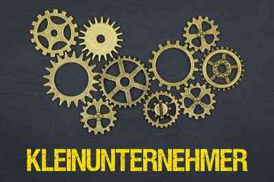 Zahnräder und Schriftzug Kleinunternehmer